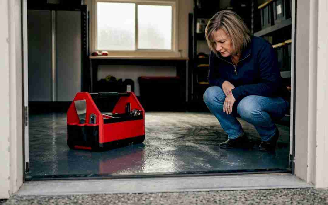 Homeowner inspecting epoxy garage floor
