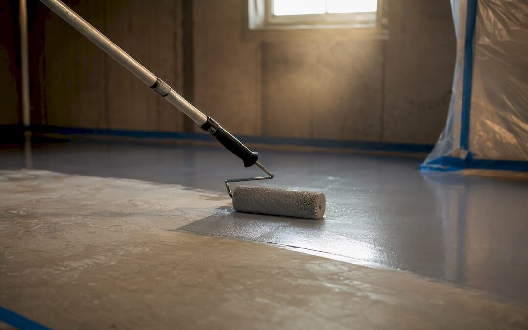 Applying epoxy coating to basement floor