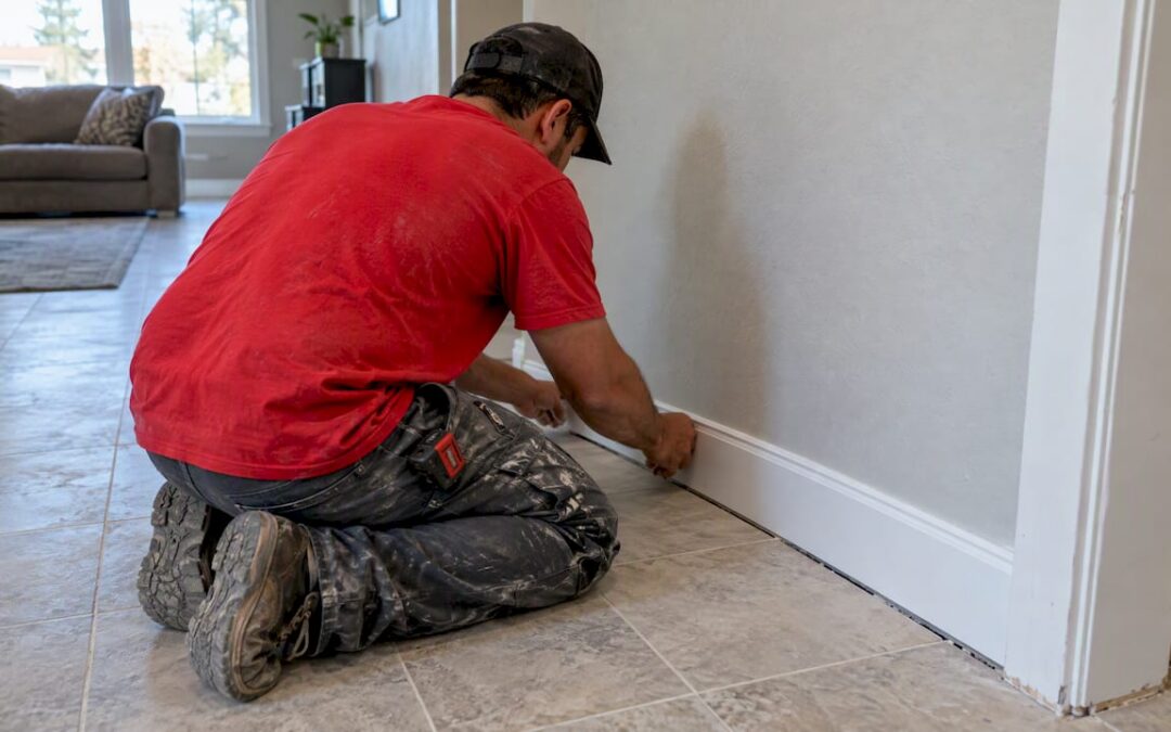 Baseboard fitted beside tiled floor movement joint