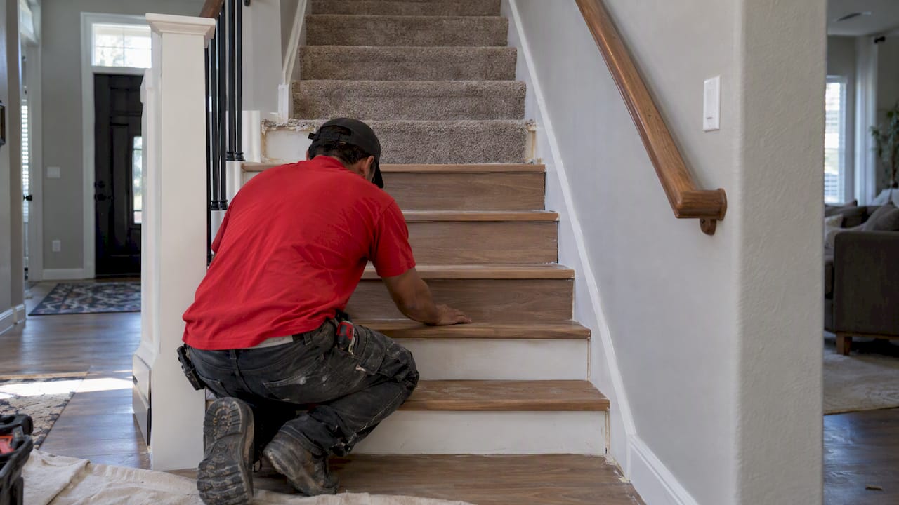Carpeted stairs transitioning to new wood treads