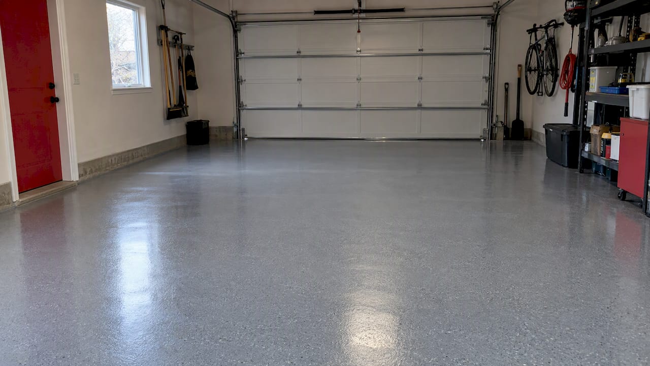 Fresh epoxy coating curing on garage floor